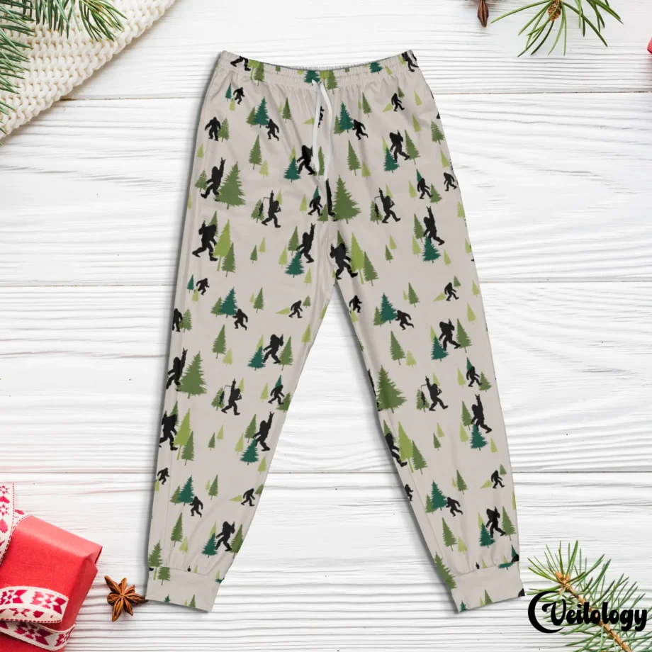 Bigfoot-themed pajama pants with Sasquatch in a forest hiking design