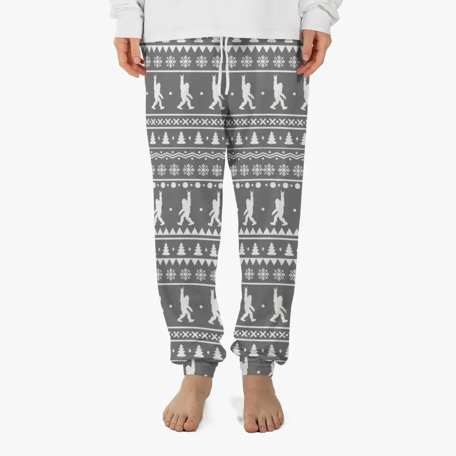 Bigfoot Ugly Christmas pajama pants with Sasquatch and a rock-and-roll hand sign