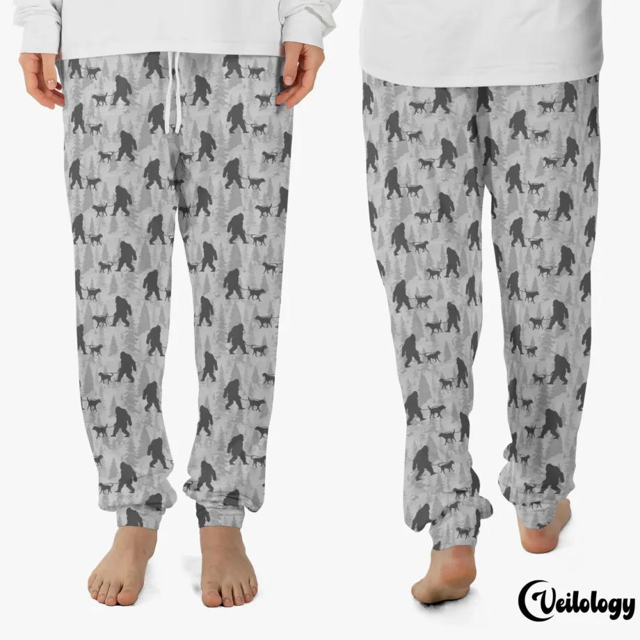 Funny Bigfoot pajama pants with Sasquatch walking a dog in a quirky pattern