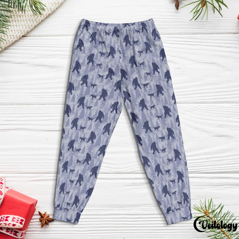 Bigfoot-themed pajama bottoms with Sasquatch and a dog in a playful design