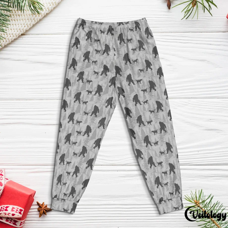 Bigfoot-themed pajama bottoms with Sasquatch and a dog in a playful design