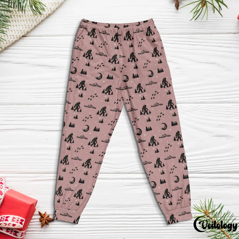 Christmas pajama pants with Bigfoot wearing a Santa hat and festive prints