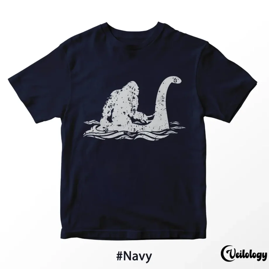 Bigfoot riding Loch Ness Monster shirt in a playful cryptid design