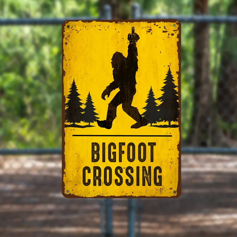 Funny Bigfoot crossing metal tin sign with Sasquatch flipping the middle finger