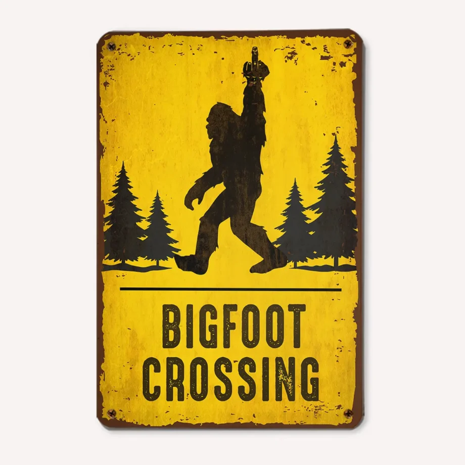 Bigfoot crossing tin sign with Sasquatch flipping the middle finger in rustic style