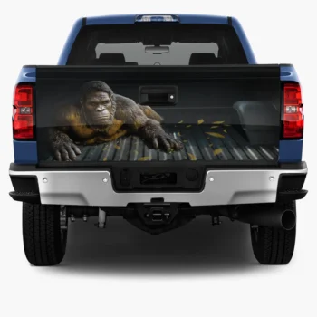 Bigfoot truck tailgate wrap decal featuring Sasquatch crawling with realistic fur design