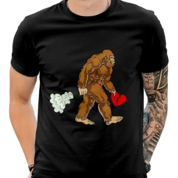 Funny Bigfoot Valentine's Day shirt featuring Sasquatch walking with a broken heart design