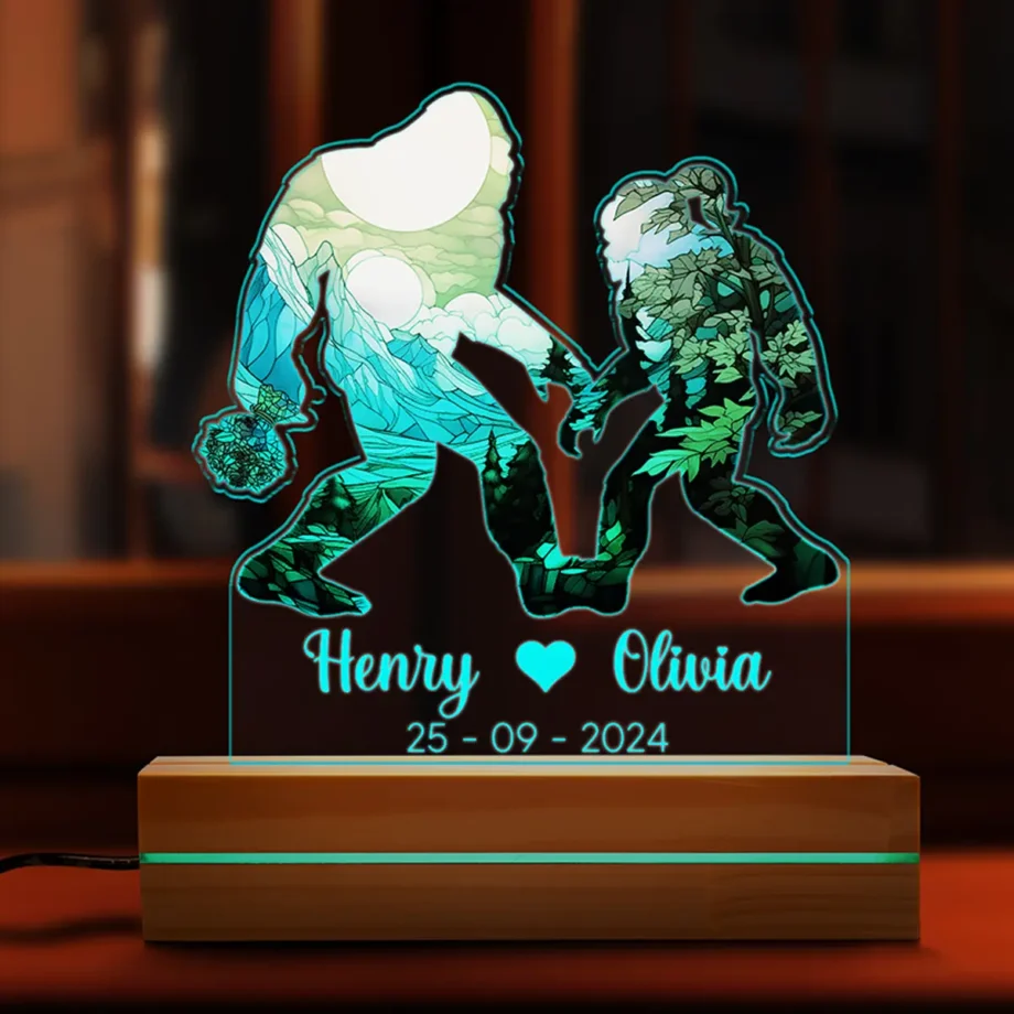 Close-up of Sasquatch couple design on Personalized Bigfoot LED Night Light, featuring custom names and glowing romantic ambiance