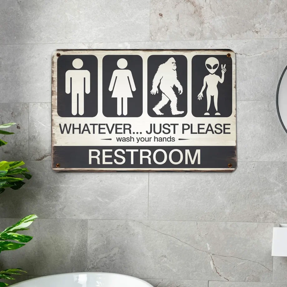 Bathroom tin sign with Bigfoot, alien, and human icons reminding to 'Wash Your Hands'