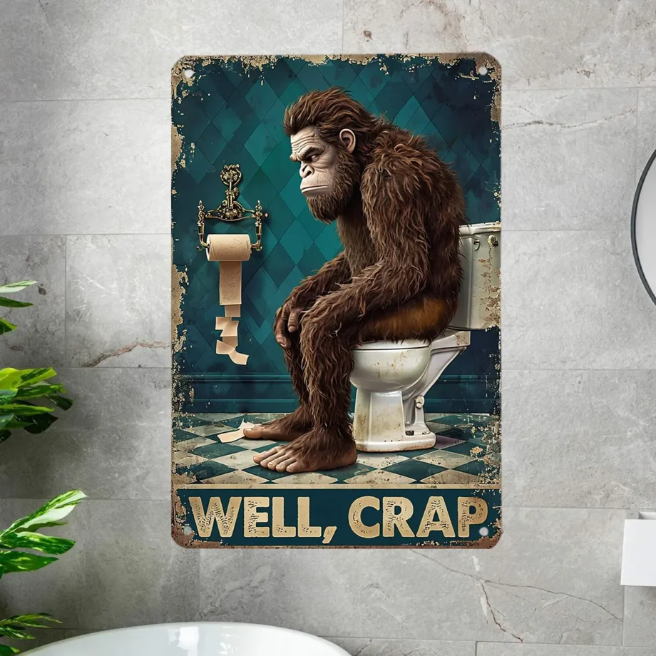 Funny Bigfoot tin sign with 'Well, Crap' bathroom scene for humorous wall decor