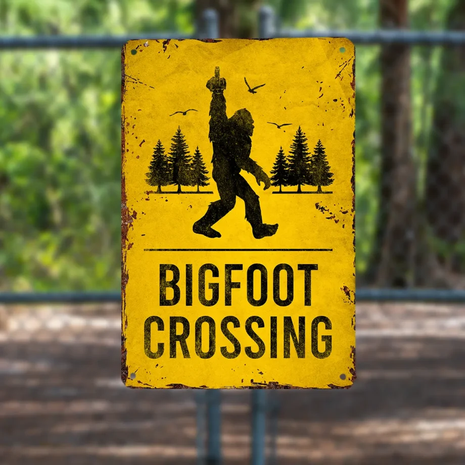 Bigfoot crossing sign with Sasquatch silhouette and cheeky middle finger gesture