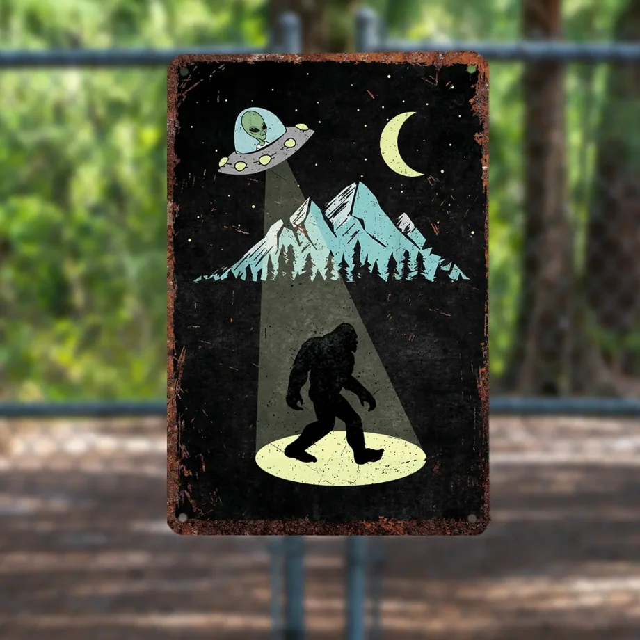 Bigfoot tin sign featuring Sasquatch and UFO under a moonlit sky